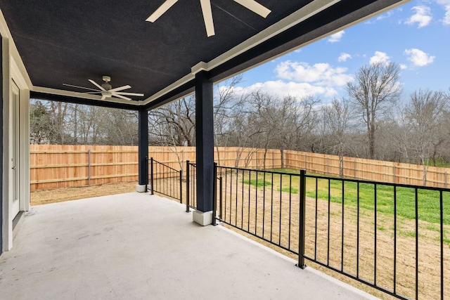 view of patio featuring a fenced backyard and a ceiling fan