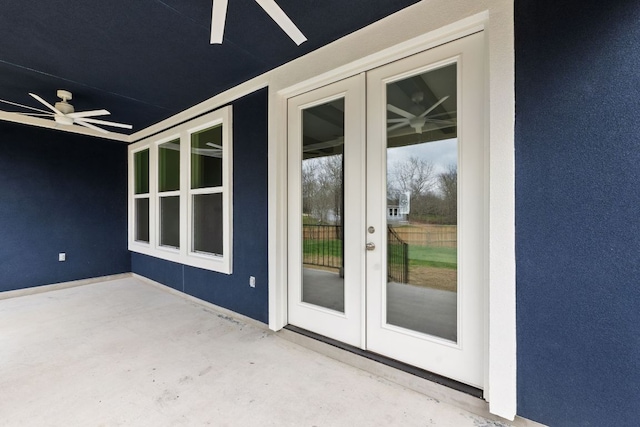 exterior space featuring french doors, a ceiling fan, and unfinished concrete floors