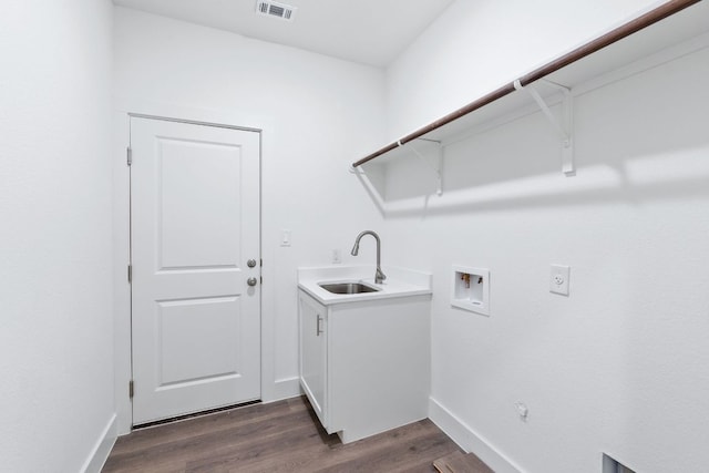 laundry area with dark wood-style floors, hookup for a washing machine, visible vents, hookup for an electric dryer, and a sink