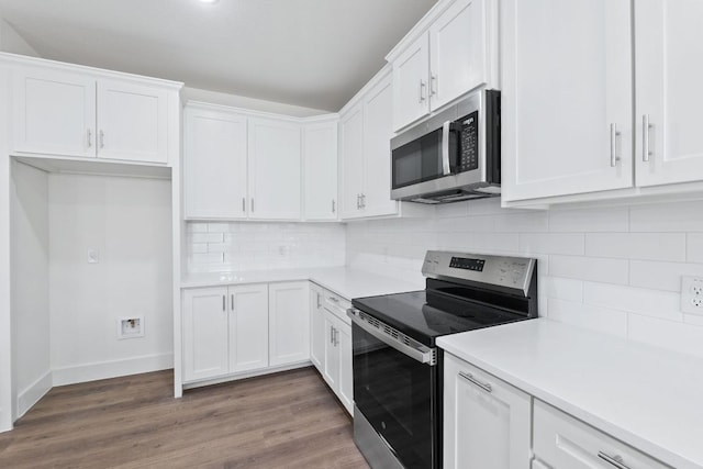 kitchen with stainless steel appliances and white cabinets