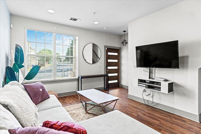 12185 Chelsea Glen Place Br, Austin, TX 78753 - living area featuring wood finished floors, baseboards, and recessed lighting