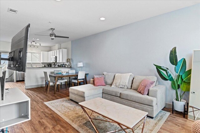 12185 Chelsea Glen Place Br, Austin, TX 78753 - living room featuring ceiling fan, light wood finished floors, recessed lighting, and baseboards