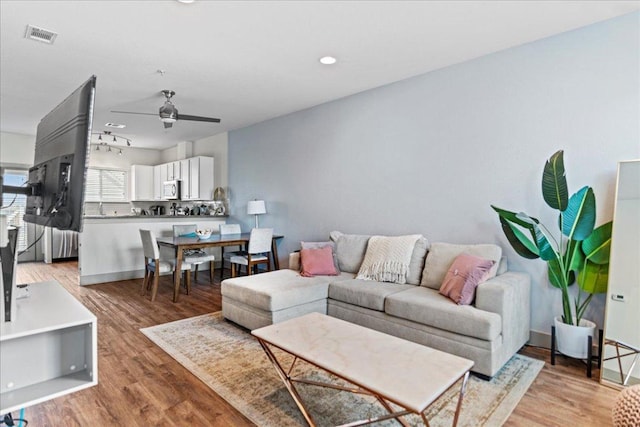 12185 Chelsea Glen Place Br, Austin, TX 78753 - living room with ceiling fan, light wood-style floors, and recessed lighting