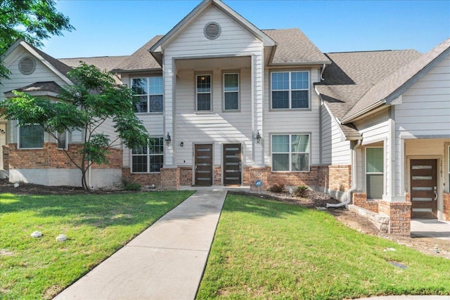 12185 Chelsea Glen Place Br, Austin, TX 78753 - view of property featuring brick siding, a front yard, and roof with shingles