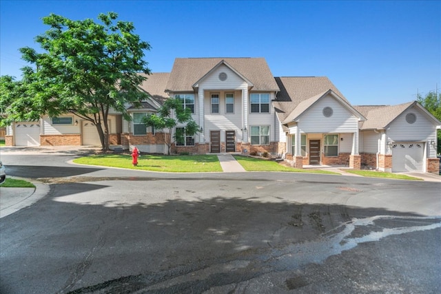 12185 Chelsea Glen Place Br, Austin, TX 78753 - view of property with brick siding, a garage, french doors, driveway, and a front yard