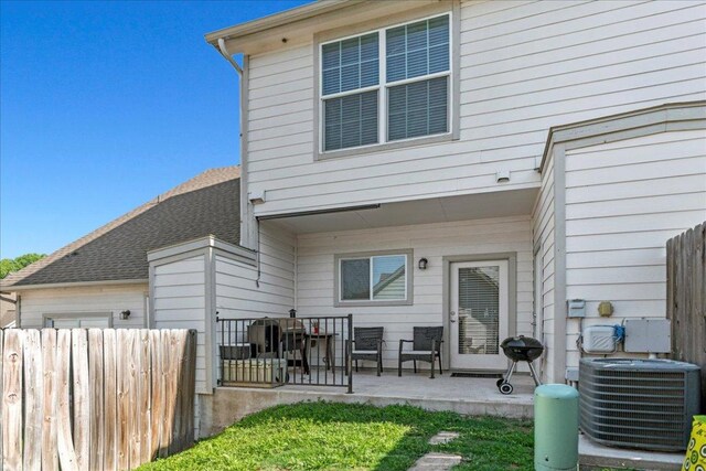 12185 Chelsea Glen Place Br, Austin, TX 78753 - back of house with central AC unit and a patio