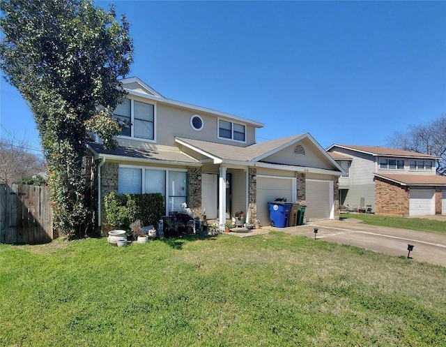 traditional-style home featuring a garage, a front yard, concrete driveway, and fence