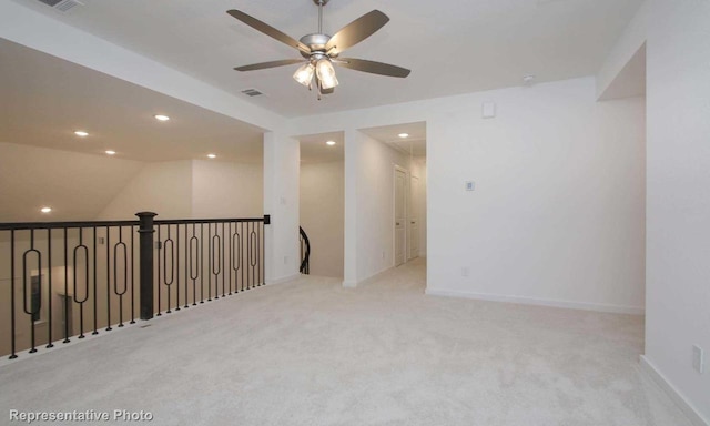 spare room featuring a ceiling fan, visible vents, carpet floors, recessed lighting, and baseboards