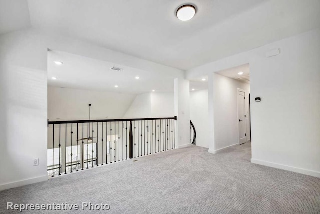 unfurnished room featuring recessed lighting, visible vents, baseboards, and carpet floors