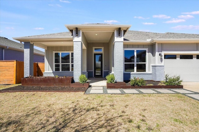 view of front of house featuring board and batten siding, an attached garage, fence, and a front yard