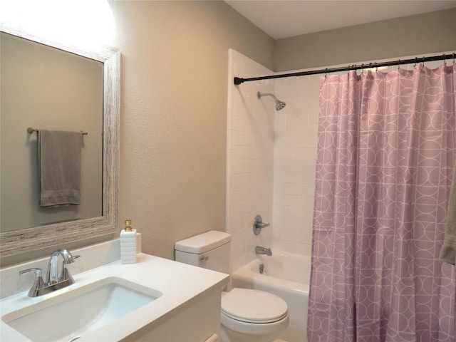 full bathroom featuring toilet, shower / tub combo with curtain, and vanity