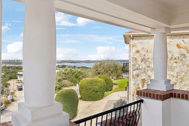 balcony featuring a water view