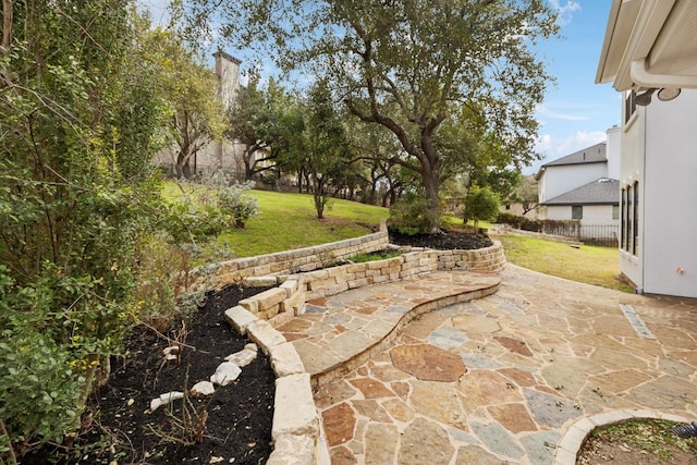 view of patio featuring fence