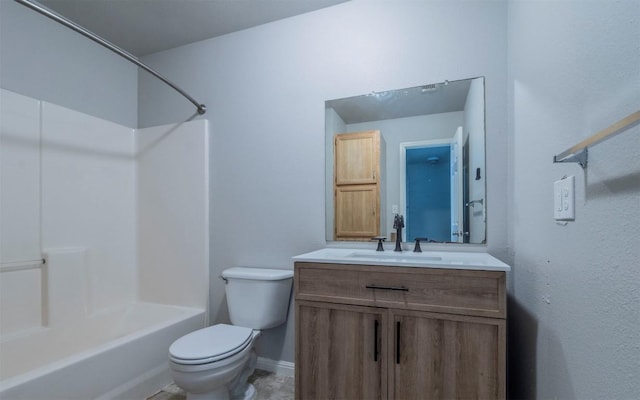 bathroom featuring vanity, toilet, tub / shower combination, and baseboards