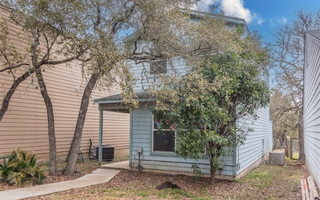 rear view of house with central AC