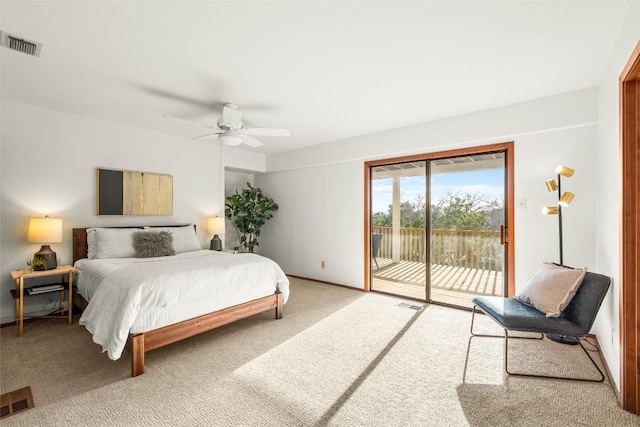 carpeted bedroom featuring access to outside, visible vents, and a ceiling fan