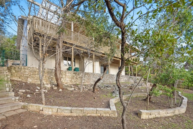 view of side of home with stone siding