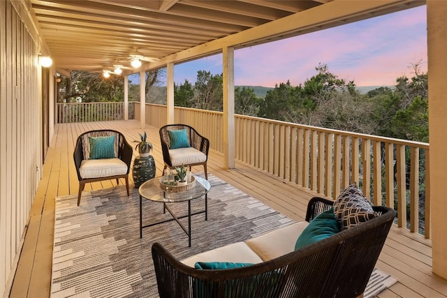 deck featuring an outdoor hangout area and ceiling fan