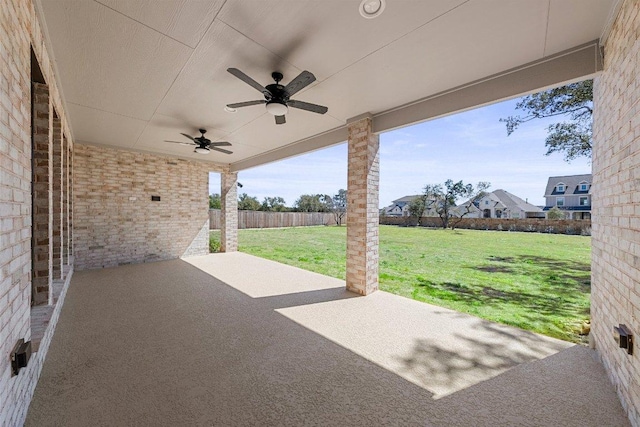 view of patio / terrace with fence and ceiling fan