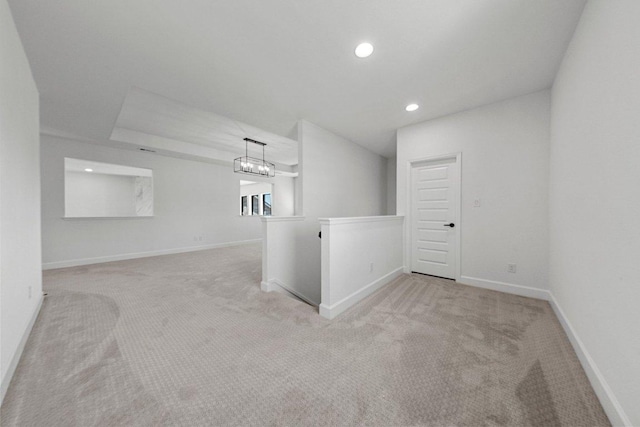 spare room featuring recessed lighting, baseboards, and carpet floors