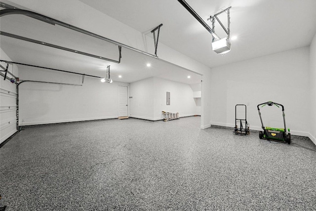 garage featuring recessed lighting, electric panel, a garage door opener, and baseboards