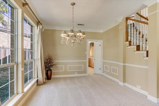 unfurnished dining area featuring carpet floors, a notable chandelier, visible vents, ornamental molding, and stairs