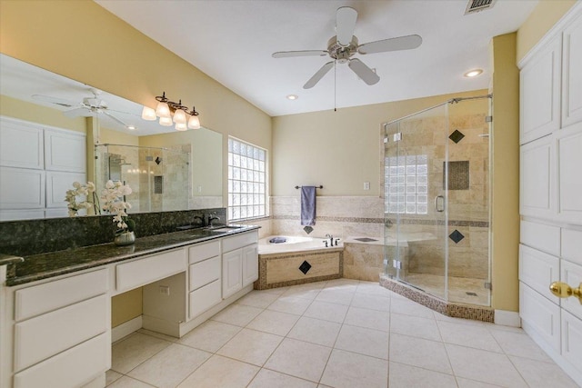 full bath featuring visible vents, vanity, a shower stall, a bath, and tile patterned floors