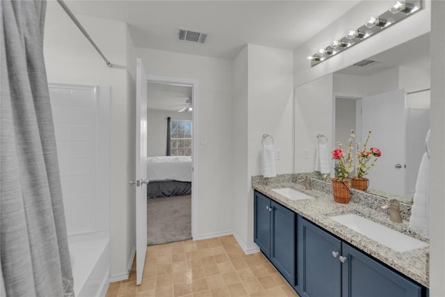 ensuite bathroom featuring shower / tub combo, visible vents, a sink, and ensuite bathroom