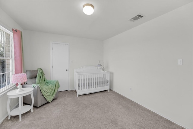 bedroom featuring carpet floors and visible vents