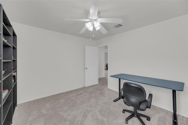 home office featuring ceiling fan, carpet flooring, and visible vents