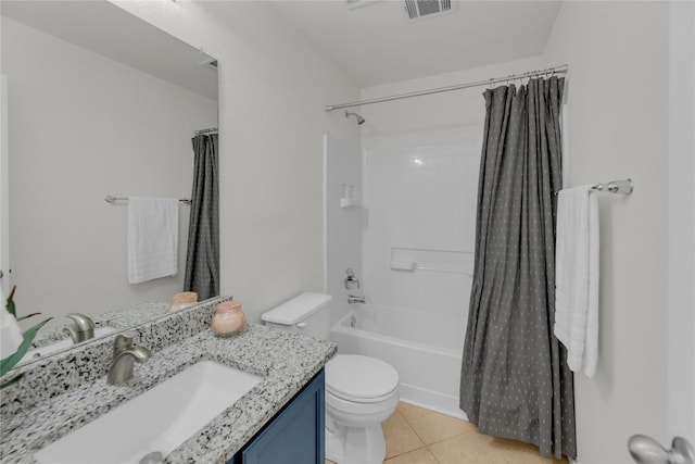 full bath with visible vents, toilet, shower / bath combo, vanity, and tile patterned flooring