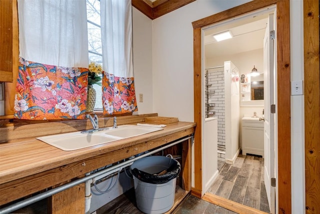 kitchen with a sink and wood finished floors