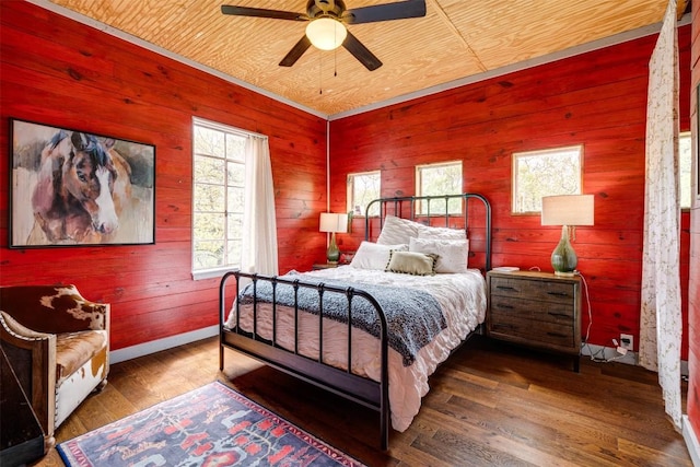 bedroom featuring wood ceiling, wooden walls, and wood finished floors