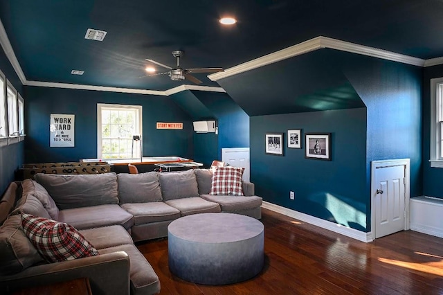 cinema with wood-type flooring, visible vents, ornamental molding, a ceiling fan, and baseboards