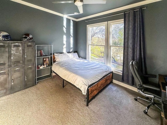 bedroom with ceiling fan, ornamental molding, carpet flooring, and baseboards