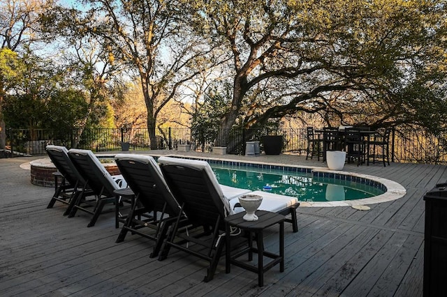 view of swimming pool featuring fence and a fenced in pool