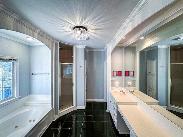 full bathroom featuring tile patterned flooring, a shower stall, vanity, and crown molding