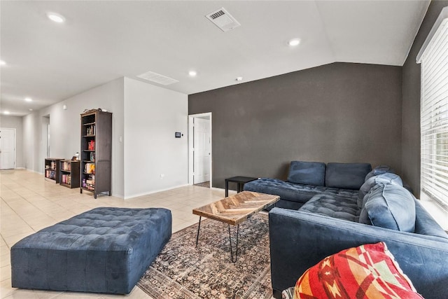 living area featuring recessed lighting, visible vents, vaulted ceiling, and light tile patterned floors