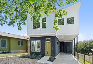 view of front of home featuring fence