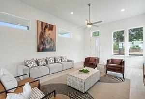 living room featuring ceiling fan and recessed lighting