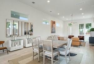 dining space featuring wood finished floors and recessed lighting