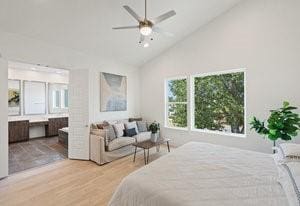 5500 Sendero Hills Pkwy, Austin, TX 78724 - bedroom with high vaulted ceiling, wood finished floors, and connected bathroom
