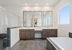 full bath with a bath, a stall shower, vanity, and recessed lighting