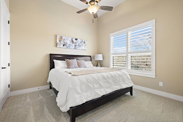 carpeted bedroom featuring baseboards