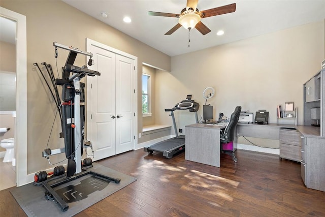 exercise room featuring recessed lighting, dark wood-type flooring, and a ceiling fan