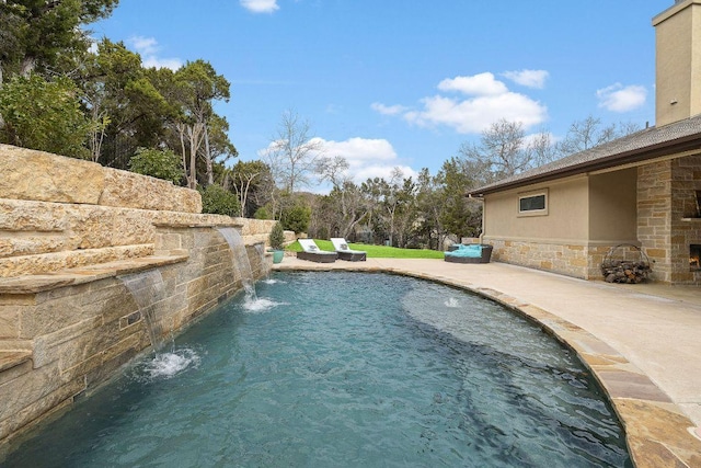 view of swimming pool featuring a patio area