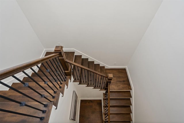 stairway featuring baseboards