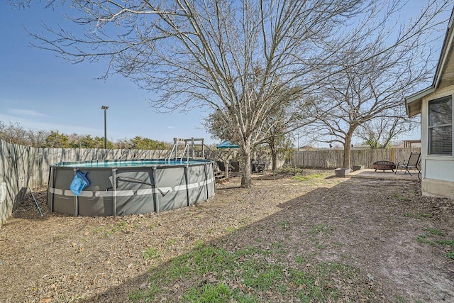 view of yard featuring a fenced backyard and a fenced in pool