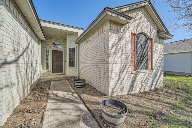 entrance to property with brick siding