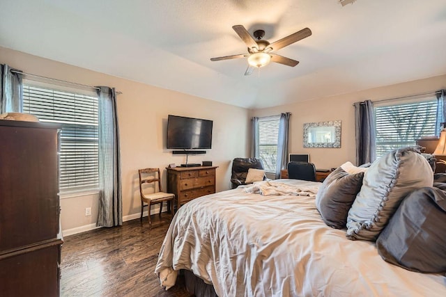 bedroom featuring ceiling fan, baseboards, and wood finished floors